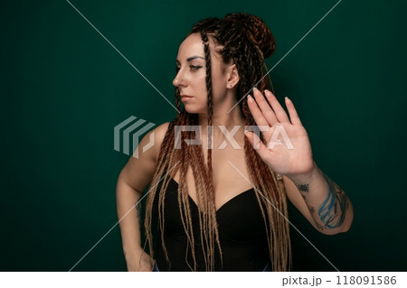 Woman With Dreadlocks Holding Her Hand Up 118091586