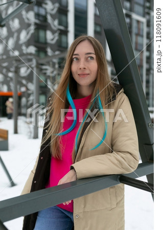 Woman in Pink Shirt Standing in Snow 118091609