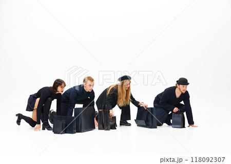Ready, steady, go. Competition for big sale offer. Group of people all in black clothes showing readiness to run, isolated on white background Ready, steady, go. Competition for big sale offer. Group of people all in black clothes showing readiness to run, isolated on white background 118092307