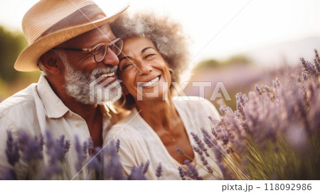 Mature Mixed Race Couple Enjoying Sunshine in Summer Lavender Field copy space 118092986