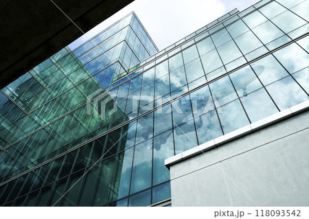 Modern glass office building. Sustainable office tower. Corporate headquarters in financial district. Green architecture. Energy-efficient skyscraper. Future of urban development and financial hubs. 118093542