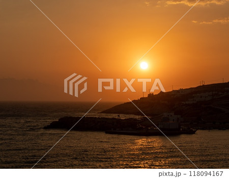 Beautiful sunset over the Aegean Sea at the Island Donousa, Greece. Beautiful sunset over the Aegean Sea at the Island Donousa, Greece. 118094167