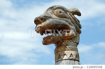 Kiev, Ukraine June 19, 2021: Figures of people and animals carved from wood - entertainment complex Kievan Rus 118095508