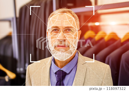 A man is wearing a suit and tie and is being photographed 118097322