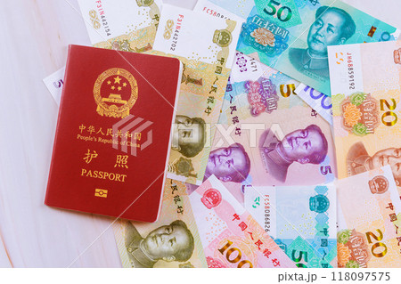 Authentic passport of People Republic of China containing Chinese cash yuan banknotes various denominations 118097575