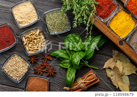 A vibrant assortment of various spices and herbs displayed together A vibrant assortment of various spices and herbs displayed together 118098679