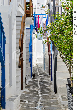 Myconos, vertical shot of the white houses with their cobbled streets. Village bathed by the South Aegean Sea, in the Cyclades, Greece Myconos, vertical shot of the white houses with their cobbled streets. Village bathed by the South Aegean Sea, in the Cyclades, Greece 118101368