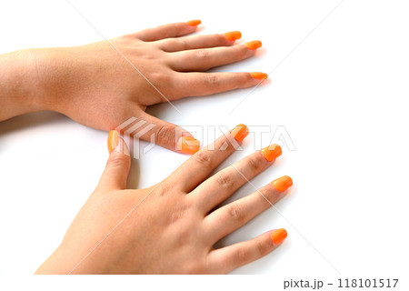 Girl's hands with orange false nails. woman manicure Girl's hands with orange false nails. woman manicure 118101517
