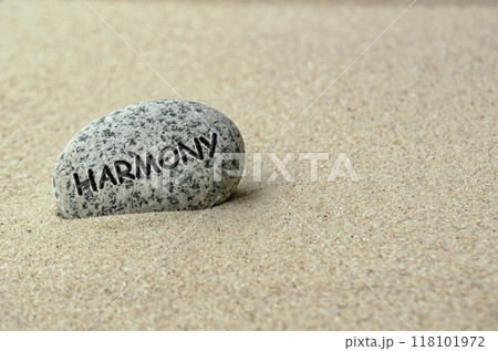 Harmony text on stone buried in the sand 118101972