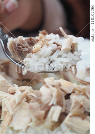 A Mouthwatering CloseUp of a Delicious Plate of Chicken Rice That Looks Absolutely Tempting 118105366
