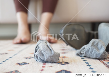 A Casual Living Room Scene featuring Socks and Bare Feet, Set for Relaxation and Comfort A Casual Living Room Scene featuring Socks and Bare Feet, Set for Relaxation and Comfort 118105448