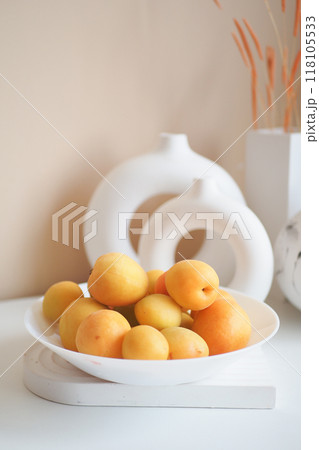 An Aesthetic and Stylish Display Featuring Fresh, Colorful Fruits Arranged in Contemporary Vases 118105533