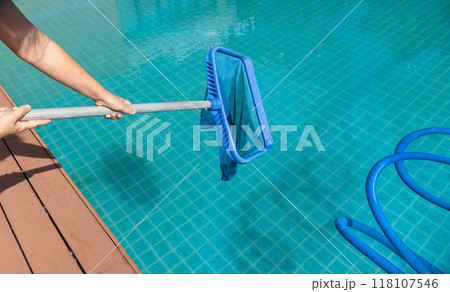 Pool maintenance with scoop net  and automatic robot cleaner. 118107546