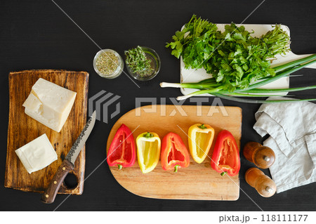Top view of ingredients for baking peppers with goat cheese and mozzarella on the table Top view of ingredients for baking peppers with goat cheese and mozzarella on the table 118111177