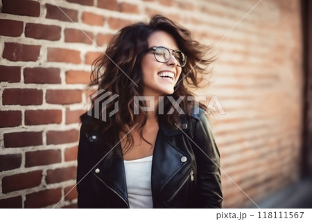 portrait of a young beautiful woman against a brick wall, modern style and fashion, lifestyle 118111567
