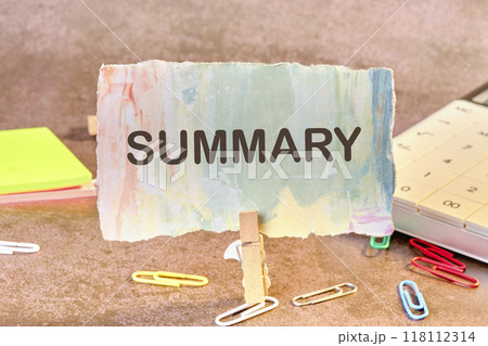 Conceptual summary word symbol. Copy space. Summary word written on a piece of paper in a clothespin Conceptual summary word symbol. Copy space. Summary word written on a piece of paper in a clothespin 118112314