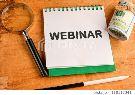 WEBINAR words written in a notebook on a papyrus background 118112341