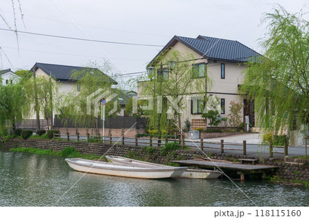 Boat at dock on Yanagawa canal by Japanese house, Fukuoka Boat at dock on Yanagawa canal by Japanese house, Fukuoka 118115160