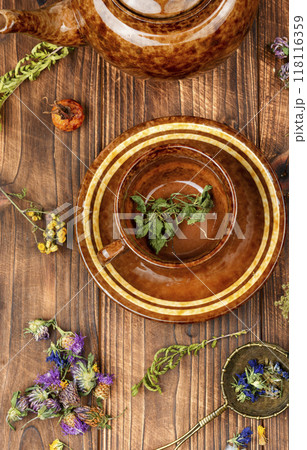 Dry herbal tea and cup. 118116359