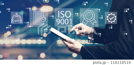 ISO 9001 concept with businessman using a tablet 118118519