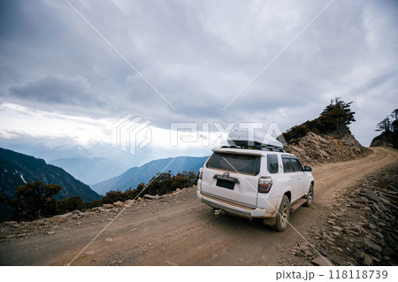Offroad car running on high altitude mountain trail in tibet, China Offroad car running on high altitude mountain trail in tibet, China 118118739