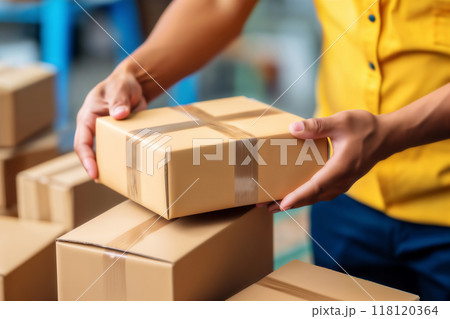 the hands of the loader shift the boxes, the concept of cargo transportation and relocation 118120364