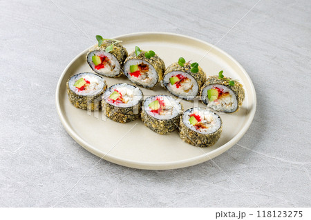 Japanese sushi tempura maki crab meat and tobiko roll on slate. Japanese traditional fusion food style, restaurant menu 118123275