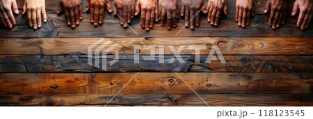 Unity diversity teamwork concept with diverse hands on rustic wooden table 118123545