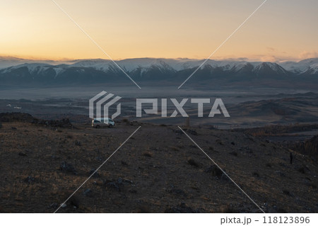 white van, parked on a autumn foggy evening steep mountain slope 118123896
