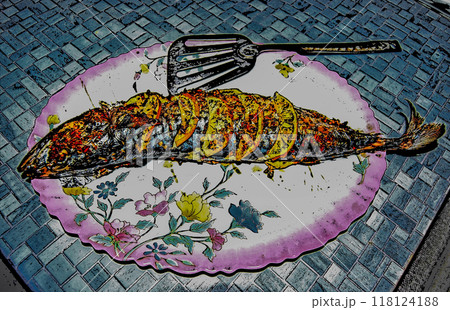 Baked mackerel on a plate. Golden Mackerel stuffed with lemon and sprinkled with spices. Baked mackerel on a plate. Golden Mackerel stuffed with lemon and sprinkled with spices. 118124188