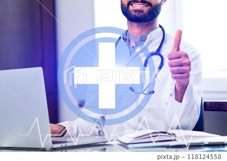 A man is giving a thumbs up to a medical symbol 118124558