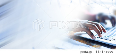A person is typing on a laptop computer A person is typing on a laptop computer 118124559