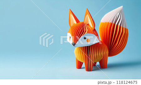 Three dimensional paper fox model, geometric design with orange tail, accordion like pleats, rounded body with polka dots, blue light background, playful and creative craft project 118124675