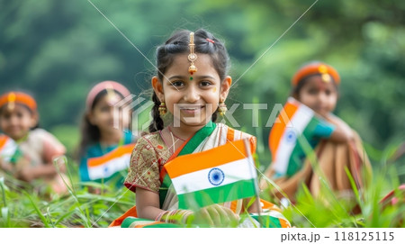 Joyful Children Celebrating India Independence Day with National Flags in Traditional Attire Outdoors 118125115