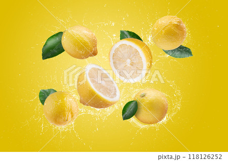 Water Splashing on Fresh Sliced Lemon and Lemon Fruit on a Yellow background 118126252