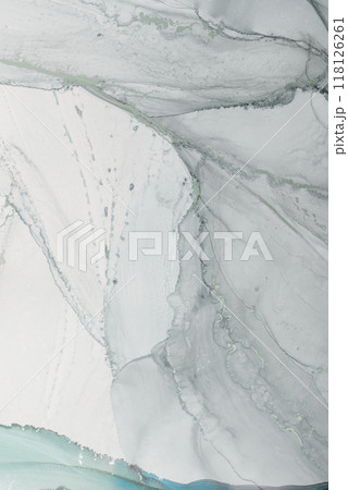 Elegant marbled pattern with soft gray and white tones displayed on a smooth surface, creating a sophisticated and serene atmosphere 118126261