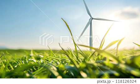 Single wind turbine in Dutch windmill park, close-up with clear blue sky, sunlight on blades, surrounded by lush green grass. Windmill park clean energy nehterlands 118126324