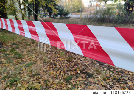 Red and white lines of barrier fencing tape. Fencing red and white tape, which prohibits movement. 118126728