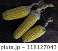 corn cobs in dark wooden background. 118127043