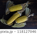 corn cobs in dark wooden background. 118127046