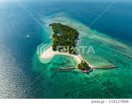 Blue ocean with sunlight reflection and white beach resort, view from above. Buenavista Island. Samal, Davao. Philippines. 118127666