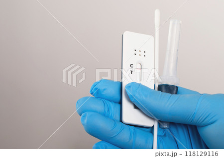 Doctor with Covid-19 test kit from the lab at the hospital Doctor with Covid-19 test kit from the lab at the hospital 118129116
