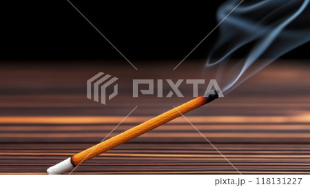 A smoldering incense stick with a small amount of smoke coming out, AI 118131227