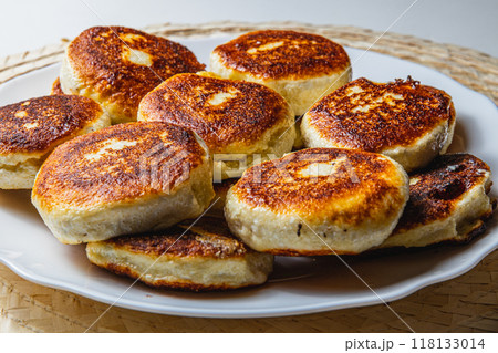 Fresh fried cottage cheese pancakes on a white plate 118133014