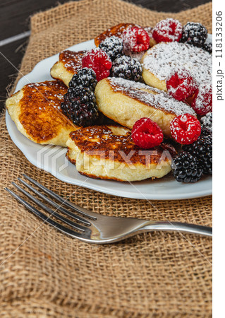 Cottage cheese pancakes with fresh raspberries, blackberries and powdered sugar Cottage cheese pancakes with fresh raspberries, blackberries and powdered sugar 118133206