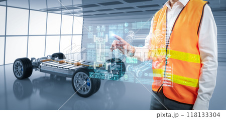 Asian engineer or technician with ev car in factory 118133304
