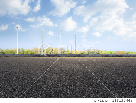 Empty road with wind turbines for green energy resource 118135445