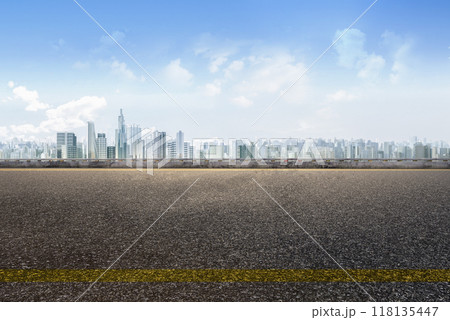 Empty asphalt road with cityscape background 118135447