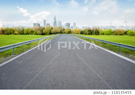 Smart city with empty road leading to cityscape 118135455