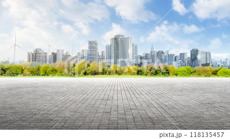 Open space or patio with green garden against cityscape background 118135457